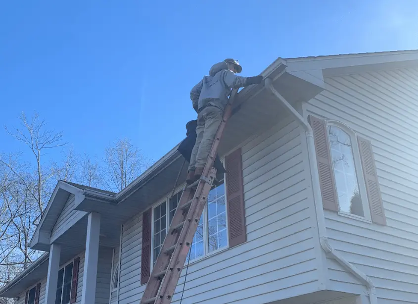 Gutter cleaning and maintenance being performed by Broadview Heights Power Washing in Broadview Heights
